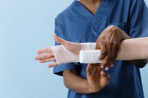 doctor wrapping workers comp injury faking