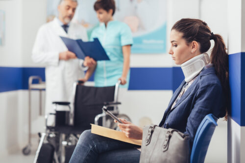 injured person at hospital neck brace