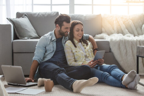 Young family couple together at home casual